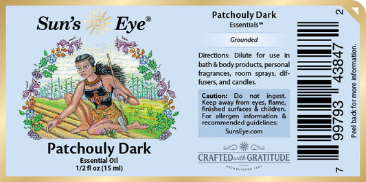 Sun's Eye Patchouly Dark essential oil label with illustration of a woman and text.