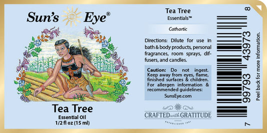 Sun's Eye Tea Tree Essential Oil label with illustration of a woman and text.