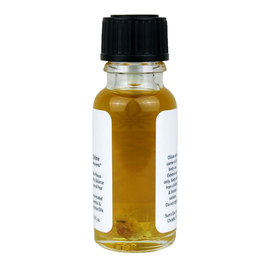 Small glass bottle with black cap and white label on a white background