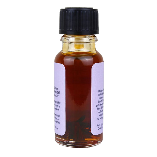 Small glass bottle with black cap and white label on a white background