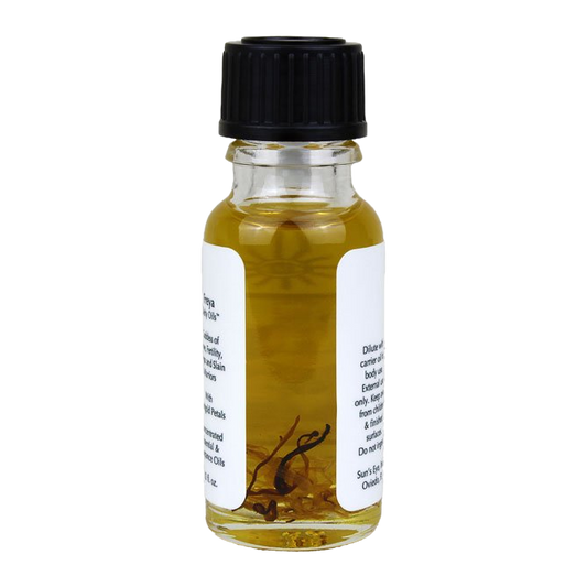 Small glass bottle with black cap and label on a white background