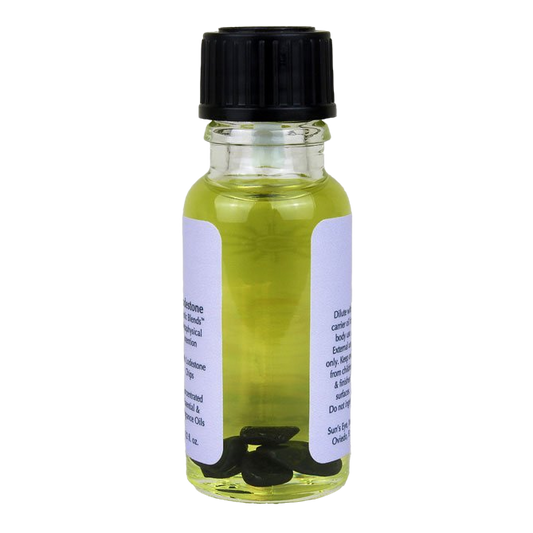 Small glass bottle with a black cap and a white label on a white background