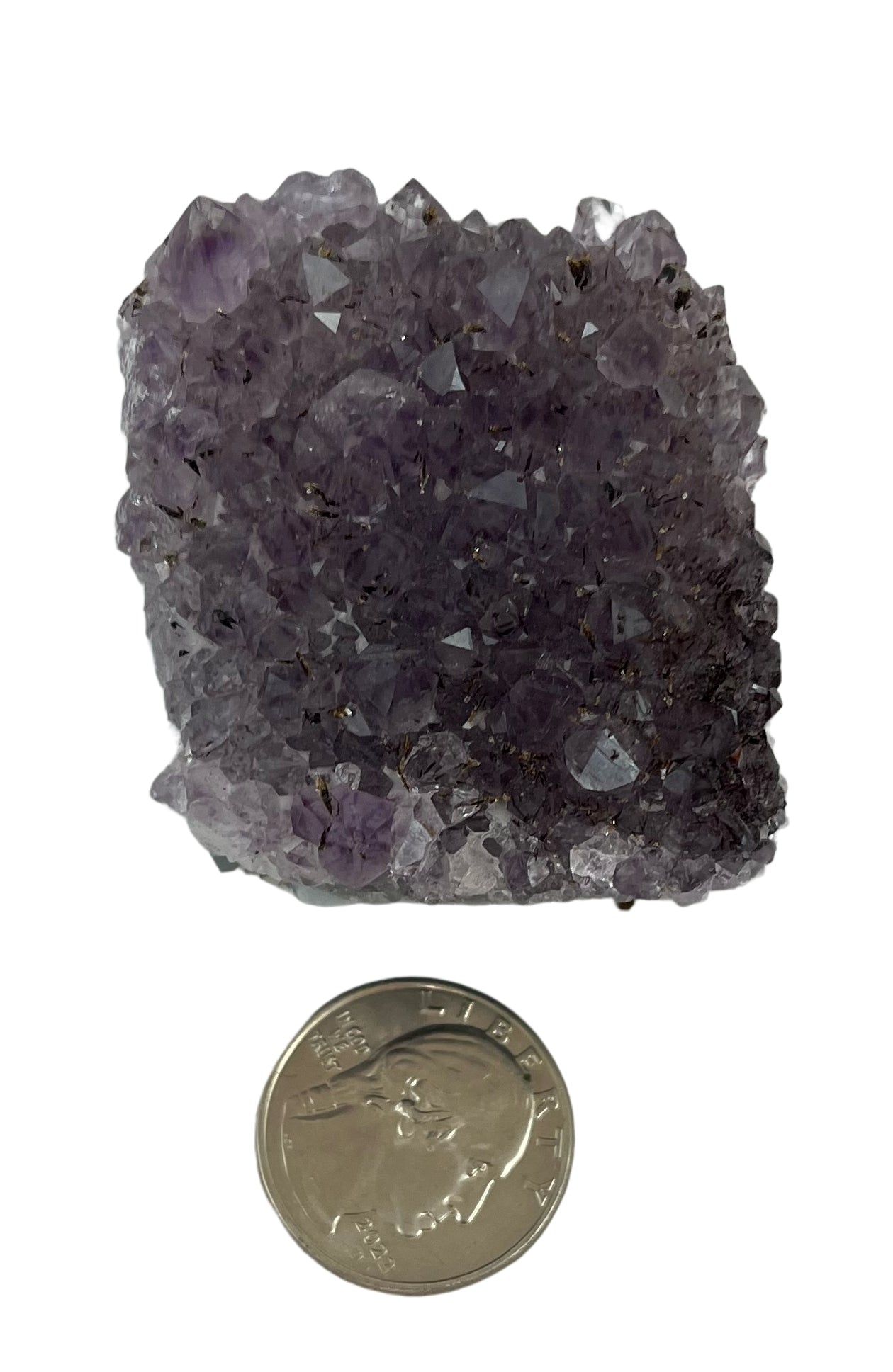 Smaller than palm size purple crystal, roughly 2 in by 2 in