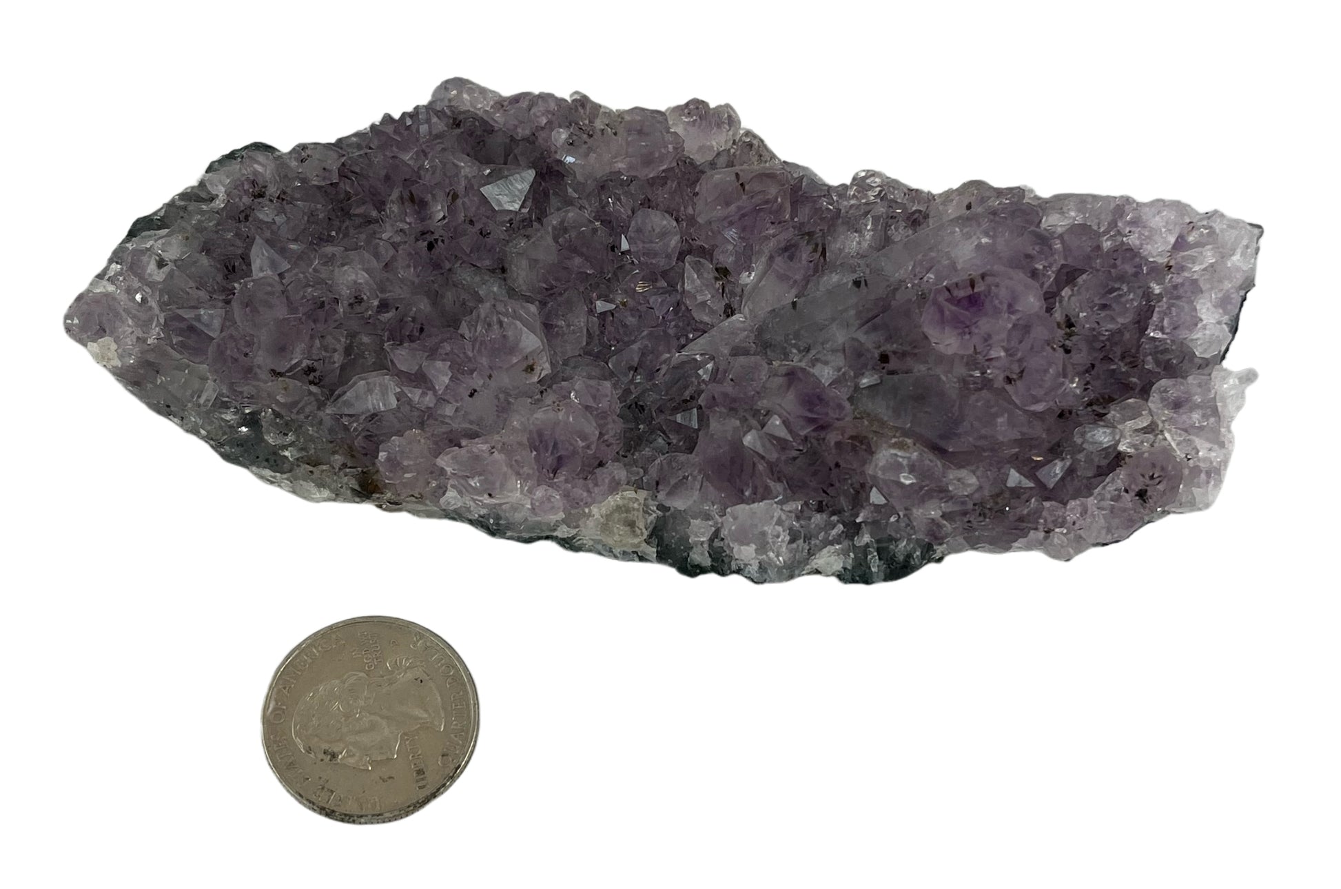 Larger than palm sized purple crystal, roughly 2.5 in by 5 in