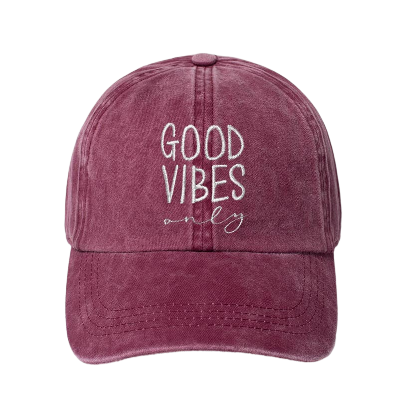 A washed burgandy baseball cap with white embroidered text reading 'GOOD VIBES only' on the front, shown against a plain white background.