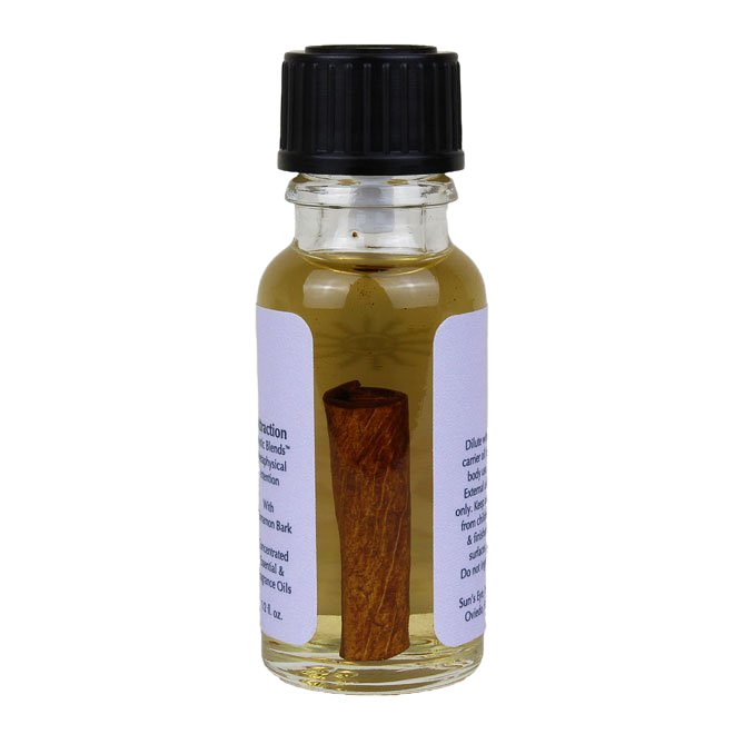 Small glass bottle with a cinnamon stick on a white background